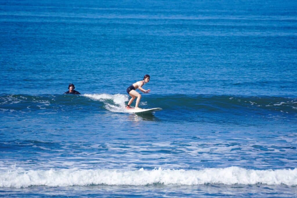 Woman surfing on a wave